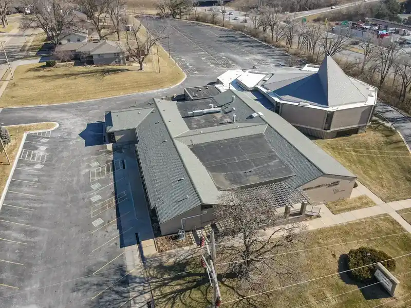 Royalty Roofing project manager reviewing documentation after commercial emergency repair in Omaha