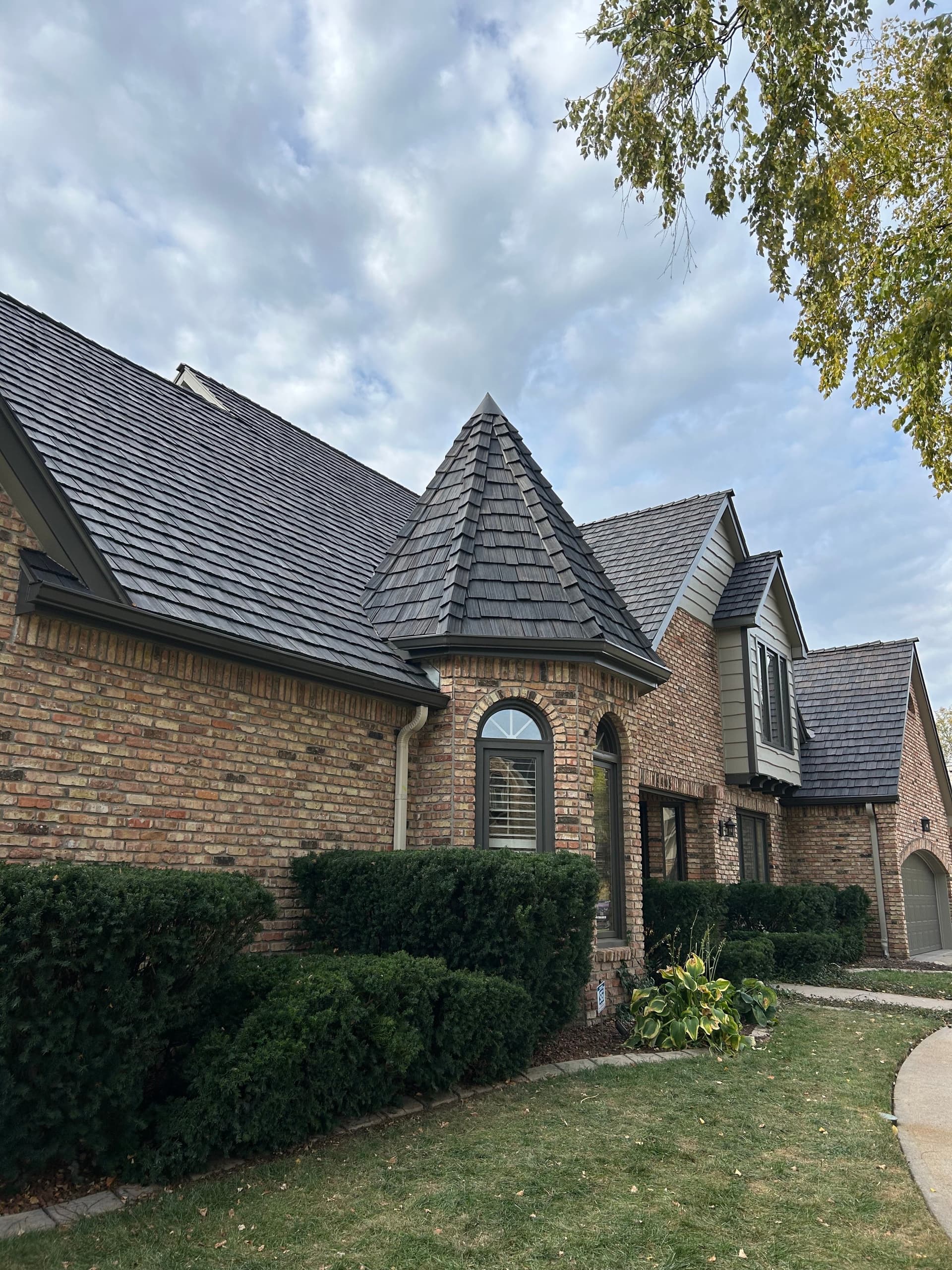 Professional roof installation crew working on Omaha home by Royalty Roofing and Siding
