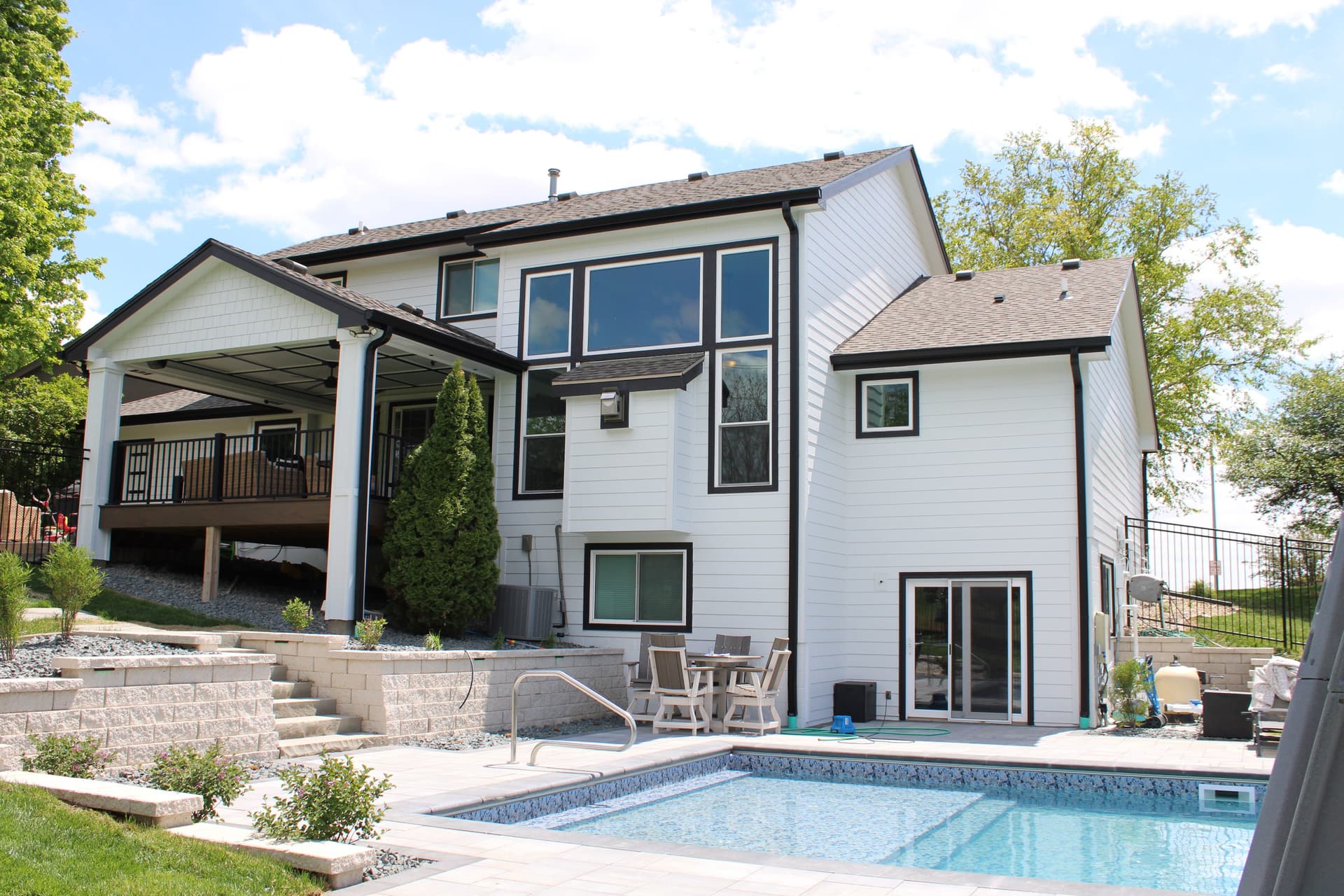 Omaha home exterior showcasing new replacement windows by Royalty Roofing and Siding