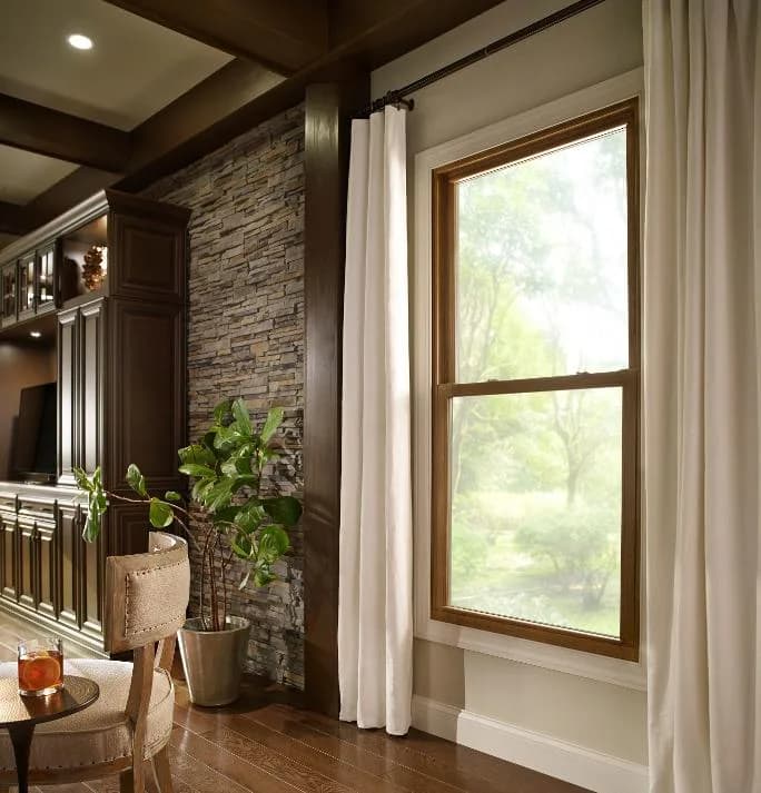 Energy-efficient window installation on Omaha home by Royalty Roofing and Siding